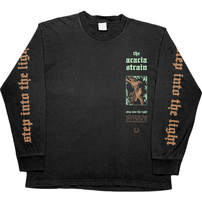 Front of The Acacia Strain Human Race Black Long Sleeve. Step Into The Light text in gold down both sleeves. On the left chest The Acacia Strain text in teal and two birds perched on a branch in gold also. 4 lines of song lyrics under the image of the birds. 