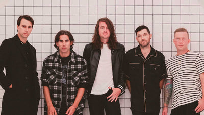 Mayday parade band promo in front of tiled wall