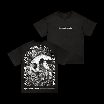 Presale: Black The Acacia Strain tee on Comfort Colors; front has band name in white, back shows a skull in grass with YOU ARE SAFE FROM GOD HERE, CITIZENS OF THE WORLD DESPAIR. Ships 8/15/25.