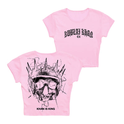 Kublai Khan TX pink Bella + Canvas 1010 crop top with black “Kublai Khan TX” gothic text on front, grunge skull art and “KHAN IS KING” on back. Available for presale; ships 10/17/25.