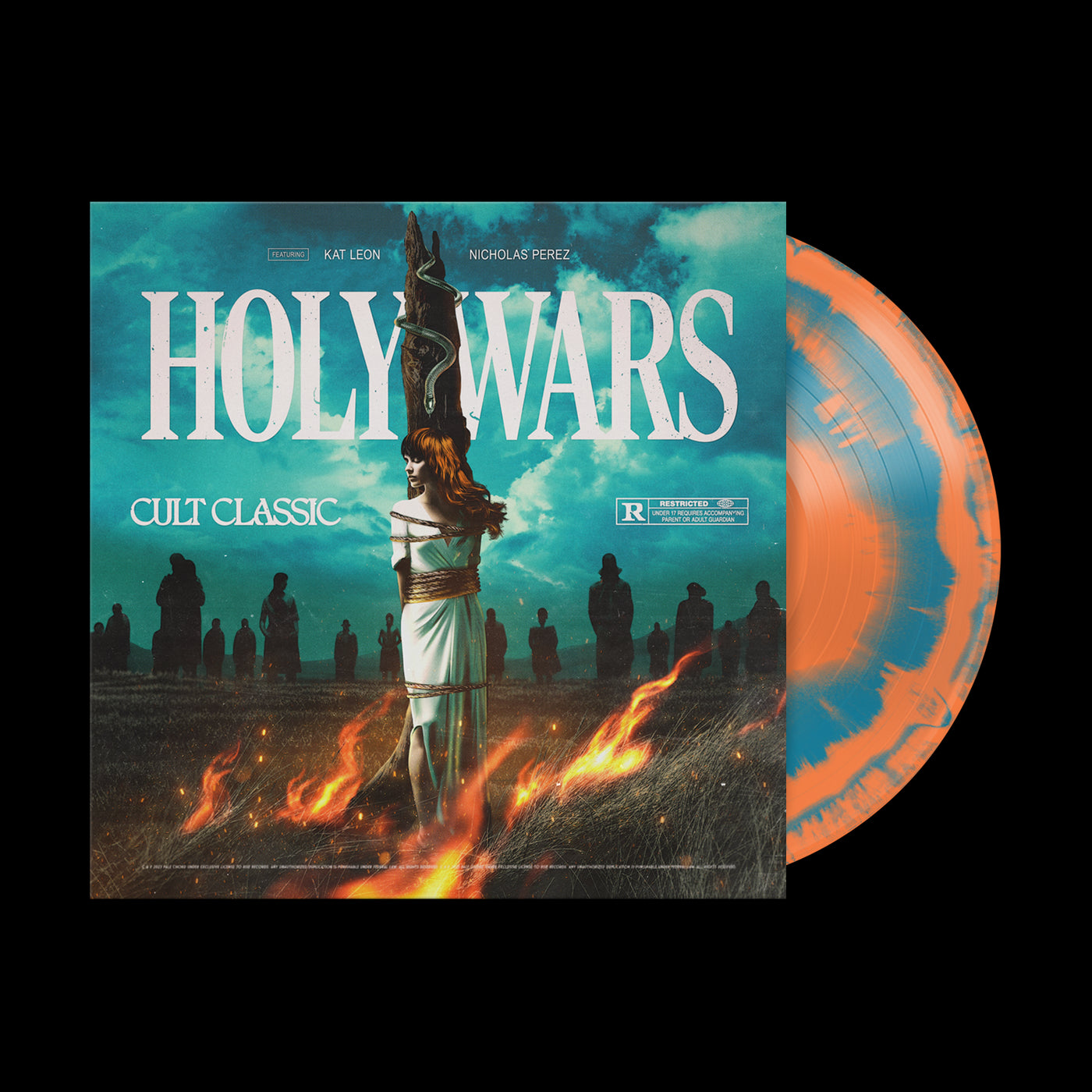 A vinyl record partially out of its sleeve features the limited edition Holy Wars cover: a woman tied to a stake with flames below, shadowy figures in a foggy field, and "HOLY WARS" in bold white letters at the top.