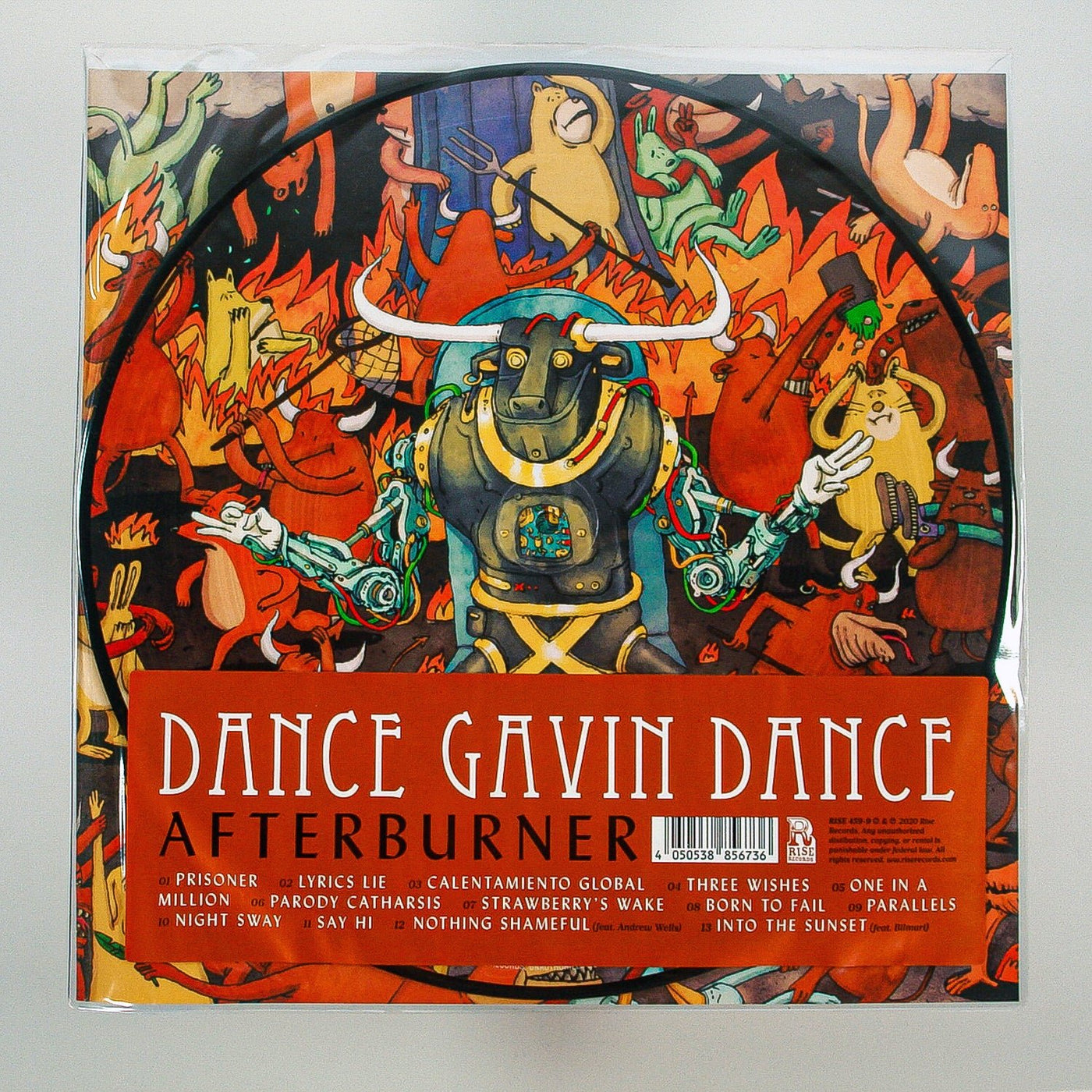 Vivid artwork for Dance Gavin Dance's Afterburner Picture Disc Vinyl LP shows a central robotic bull with raised arms, surrounded by cartoon-like dancers. The tracklist sits at the bottom on a red banner. Limited Edition release.