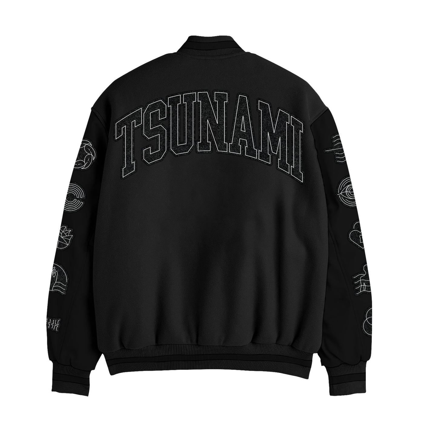 Spiritbox black wool and leather varsity jacket shown from the back features bold chenille "TSUNAMI" text across the shoulders and white wave-inspired designs on both sleeves.