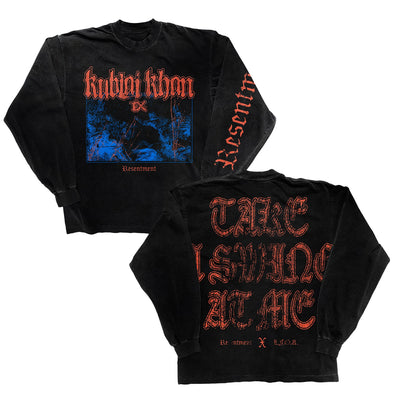 Black Alstyle long-sleeve t-shirt by Kublai Khan. Features red gothic "Kublai Khan" above a blue graphic and "Resentment" on the front; "Resentment" in red on the sleeve, and "TAKE A SWING AT ME" printed on the back.