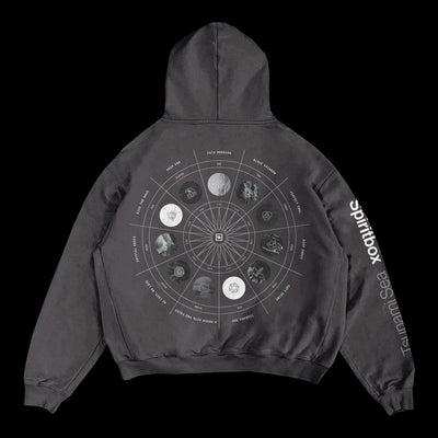 A black Spiritbox Zodiac Vintage Hoodie made from premium French Terry Cotton, featuring a circular zodiac chart and astrological symbols on the back. “Spiritbox” and “Tsunami Sea” are printed in white on the right sleeve.