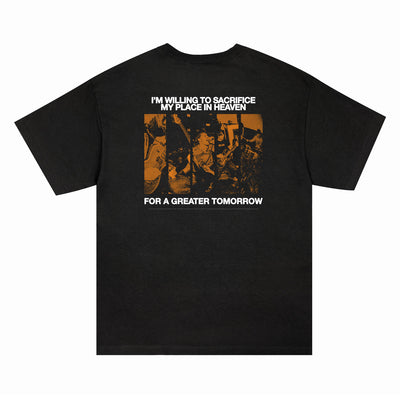 Black Comfort Colors t-shirt by I Promised The World featuring a vibrant orange collage and bold white back text: IM WILLING TO SACRIFICE MY PLACE IN HEAVEN FOR A GREATER TOMORROW. Presale available—reserve yours before shipping starts!.