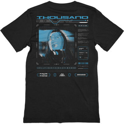 back of black t-shirt with cyber punk style web page art including a face and various text 